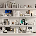 Decorative Ornament Set With Books Photo Frames Vases Sculptures And Green Plants On White Shelves