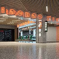 Modern Mall Shop With Orange Signage Green Seats Glass Door And Shrimp Cake