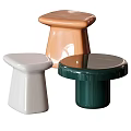 Modern Stylish Glossy Ceramic Stools With White Orange Green Hues And Unique Shapes
