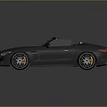 Gray Convertible Sports Car With Open Top Sleek Design And Black Wheels On Reflective Surface