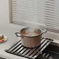 Steaming Pot on Metal Rack in Modern Kitchen Counter with Fresh Vegetable Plate