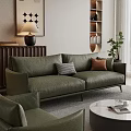 Modern Green Leather Sofa With Plaid And Brown Cushions And Round Coffee Table