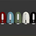 Assorted Colored Electric Kettles with Silver Handles on Reflective Surface