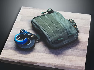 Green Tactical Pouch With Tape Rolls Placed On Wooden Cutting Board 3d model