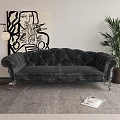 Elegant Tufted Velvet Two Seater Sofa With Metal Legs Abstract Painting And Green Plant