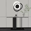 Minimalist Console Table with Circular Decorative Mirror and Green Plant on White Wall