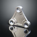 Triangular Metal Mechanical Part With Three Holes Shiny Surface And Reflective Base 3d model