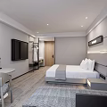 Hotel Room Interior Modern Minimalist Design With Large Bed Sofa Desk And City View Window