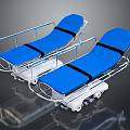 Two Blue Wheeled Nursing Beds With Metal Frame And Black Straps For Home Care