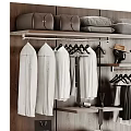 Organized Modern Wardrobe Interior With Hanging Shirts Pants Hats Wooden Shelves And Drawers