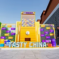 Tasty China Themed Yellow Installation With Colorful Balls Purple Signs Green Plants And Brick Wall
