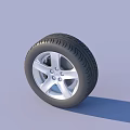 Car Tire With Silver Alloy Wheel Rim And Detailed Tread Pattern Design