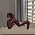 Unique Red S Shaped Lounge Chair Near Window With Blinds Light Walls And Carpet