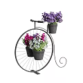 Colorful Flowers In Black Pots On Decorative Iron Bicycle Planter Stand