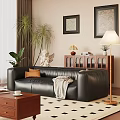Black Leather Three Seater Sofa With Orange Cushion Gray Blanket And Coffee Table