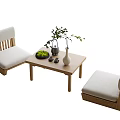 Elegant Wooden Tea Table And Chairs With Cushioned Seats Green Plant And Vase
