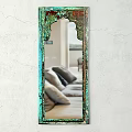 Decorative Green Ornate Frame Mirror Reflecting Living Room Sofa And Pillows