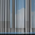 Beige Curtains with Red Tassels and Sheer White Panels for Window with Blue Sky Background