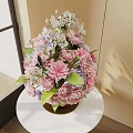 Elegant Pink Purple White Flowers with Green Leaves in Transparent Glass Vase on Table