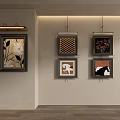 Wall Decor With Various Patterned Paintings And Wall Light In Beige Room