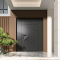 Black Security Door With Radiant Line Pattern Silver Handle Brown Wall And Green Plant
