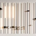 Modern Slim Tube Wall Sconces With Matte Black White Metallic Finishes Arranged On White Wall