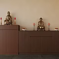Traditional Buddhist Altar Setup With Two Golden Buddha Statues Red Candles And Fruit Offerings