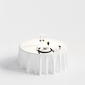 Round Dining Table With White Tablecloth Candles Cutlery Wine Glass And Food Plate