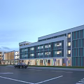 Modern School Building With Multiple Floors Large Glass Windows Teal Stripes And Parking Lot