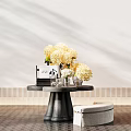 Modern Black Console Table with Yellow Hydrangeas Books and Beige Ottoman on White Wall