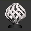 Stylish Modern Electronic Appliance Featuring Silver Spiral Design And Black Base