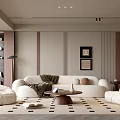 Modern Living Room with Beige Sofa White Bean Bags Round Coffee Table and Patterned Rug