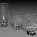 Three Transparent Glass Cups With Different Textured Designs And Stable Bases