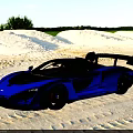 McLaren Blue Racing Car On Sandy Beach With Aerodynamic Rear Wing
