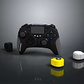 Black Game Controller With Display And Small Accessories Including Yellow White Components