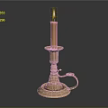 Antique Brass Candle Lamp With Lit Yellow Candle And Decorative Reflective Base