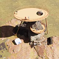 Roadside Scenic Observation Facility Built On Large Rocks With Wooden Platform Metal Ladder And Tent