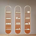 Three Gold Arch Shelves With Bottles Boxes And Wine Glasses Decor