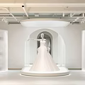 Elegant Bridal Shop Interior Featuring Wedding Dress Display Platform And Modern Furniture