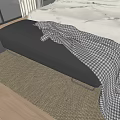 Black Footstool With Plaid Blanket Beside Bed On Wooden Floor And Woven Rug