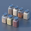 Set of Glass Spice Jars With Metal Lids Containing Various Colored Seasonings