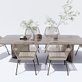 Outdoor Garden Table With Modern Wooden Tabletop And Woven Chairs With Green Plants