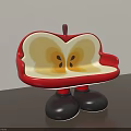 Apple Shaped Public Chair With Red Exterior Yellow Interior And Black Legs