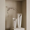 White Ceramic Vases With Slender Branches And Brown Leaves In Beige Minimalist Interior