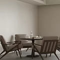 Round Meeting Table and Chairs with Light Colored Seats Wooden Frame and Tea Set in Minimalist Modern Room
