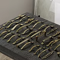 Brass Cabinet Door Handles With Various Designs Displayed On Wooden Board