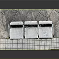 White Three Seat Bench With Metal Frame On Tile Platform With Moss Edge