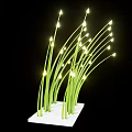 Decorative Ornament Set With Green Grass Like Stems And Small Yellow Lights On White Base