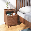 Modern Wooden Bedside Table with Plant Vase Blue Mug Green Book and Cards