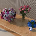 Beautiful Flowers in Vases on Wooden Table with Mixed Bouquet Pink Roses and Blue Hydrangeas